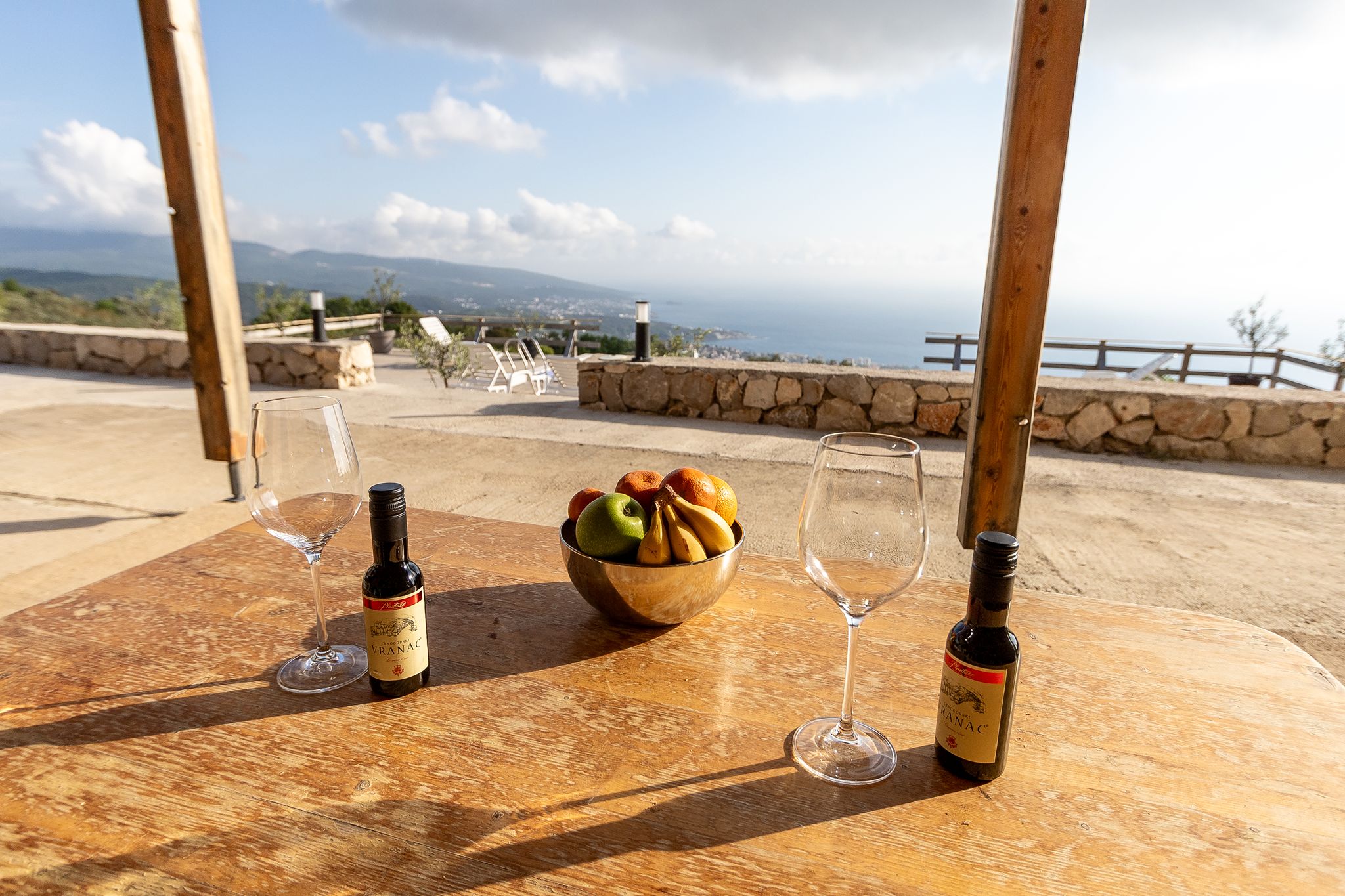 Terrace table with wine and sea view